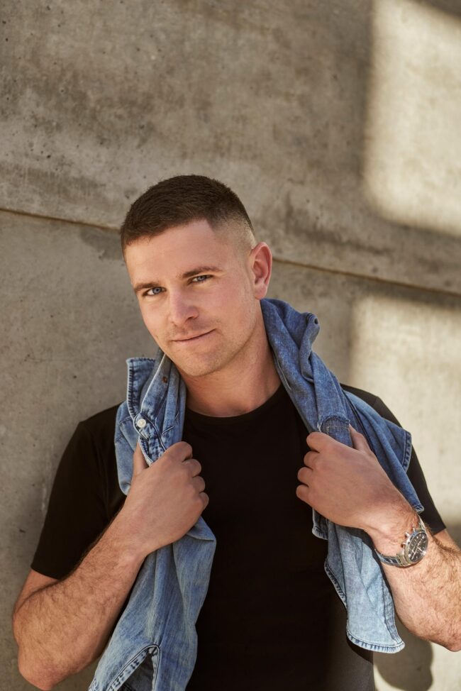 Stylish dating profile photo for men, casual outdoor portrait with denim jacket for dating apps, natural profile image for Hinge, Bumble, Tinder, and online dating profiles