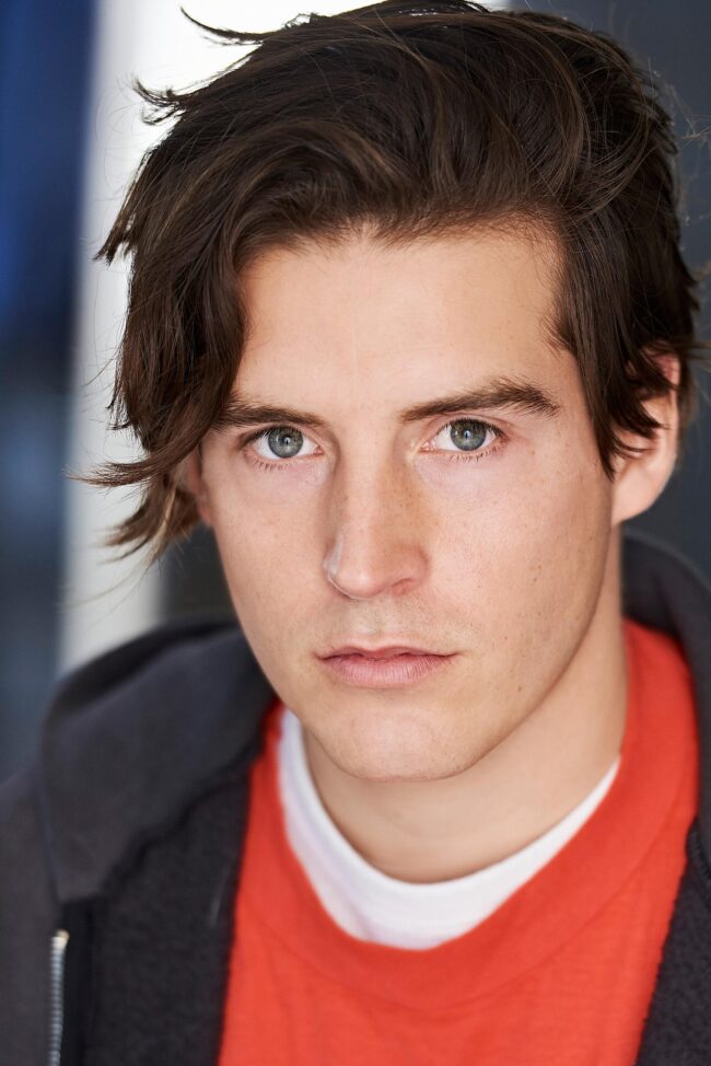 Actor's emotive expression in a theatrical headshots session, Theatrical headshots capturing an actor's dramatic flair, Close-up of an actor's intense gaze in theatrical headshots, Artistically lit theatrical headshots for a stage performer, Aspiring actor's personality shining through in theatrical headshots, Theatrical headshots highlighting an actress's versatility, Expressive and dynamic theatrical headshots for a portfolio, Black and white theatrical headshots showcasing an actor's intensity, Young actor's vibrant energy captured in theatrical headshots, Theatrical headshots reflecting a performer's unique character