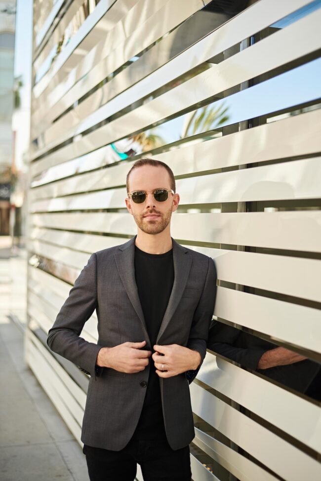 Stylish dating profile photo for men, polished outdoor portrait with blazer and sunglasses for online dating profiles, confident image for Hinge, Bumble, Tinder, Raya, and matchmaking platforms