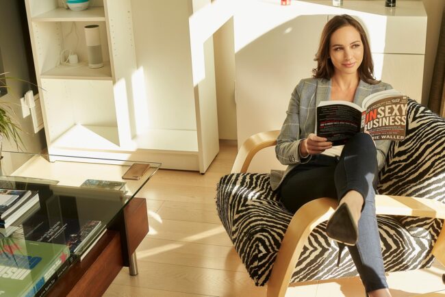 Realtor lifestyle photo in Los Angeles, professional woman seated in a modern home lounge, polished image for realtor website, Zillow profile, social media, marketing, and personal branding
