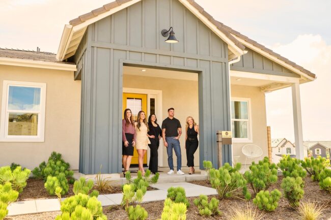 Realtor team lifestyle photo in Los Angeles, real estate professionals photographed outside a residential home, polished image for brokerage website, team bio, social media, marketing, and client trust
