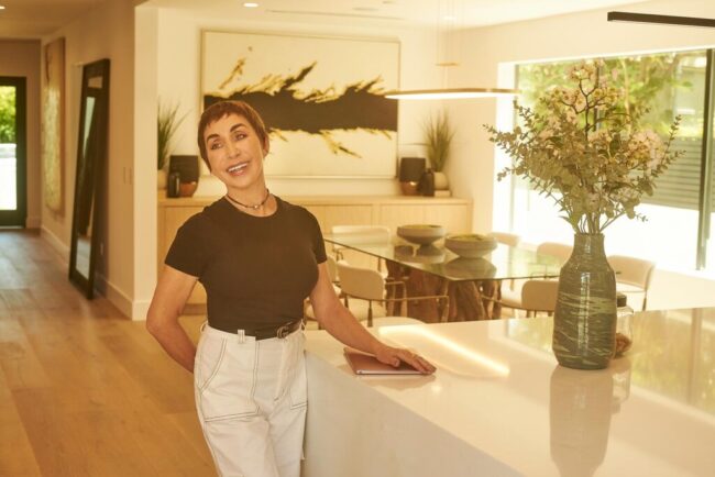 Realtor lifestyle photo in Los Angeles, professional woman photographed inside a modern home interior, polished image for realtor website, Zillow profile, social media, marketing, and personal branding