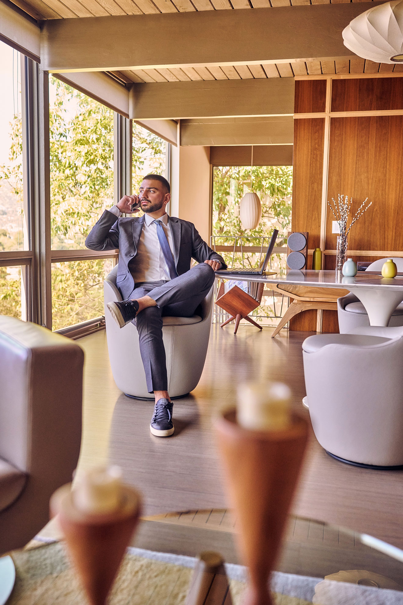 Realtor Lifestyle Photo in a Modern Home Interior Realtor lifestyle photo in Los Angeles, professional man photographed in a modern home interior with phone and laptop, polished image for realtor website, Zillow profile, social media, and marketing