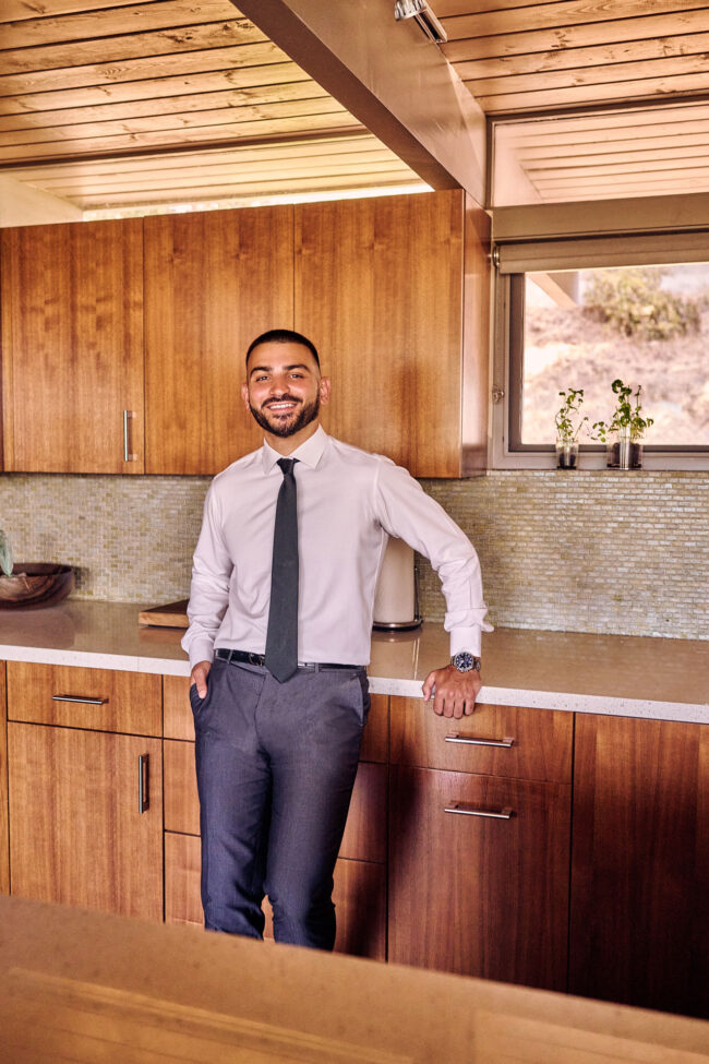 Realtor lifestyle photo in Los Angeles, professional man photographed in a modern kitchen interior, polished image for realtor website, Zillow profile, social media, and marketing