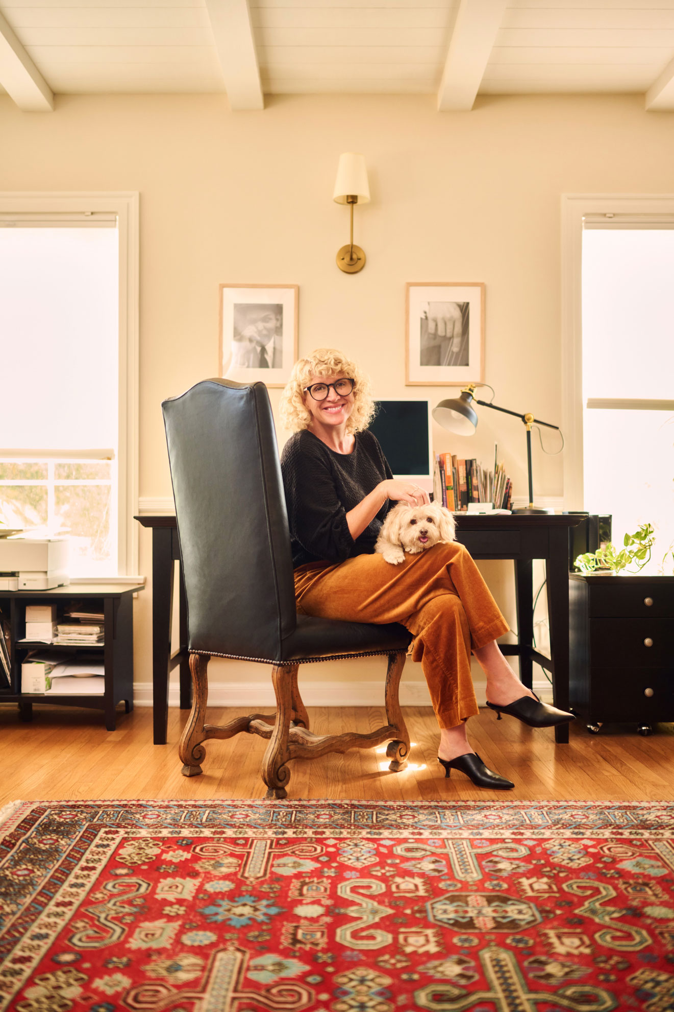 Realtor Lifestyle Photos: Enhancing Real Estate Branding with Quality Imagery Realtor lifestyle photo in Los Angeles, professional woman photographed in a home office with a small dog, approachable image for realtor website, social media, marketing, and personal branding