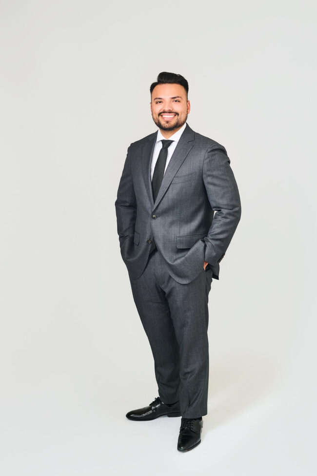 Corporate business portrait in Los Angeles, professional full-body headshot with gray suit, clean studio background, LinkedIn headshot and company website portrait