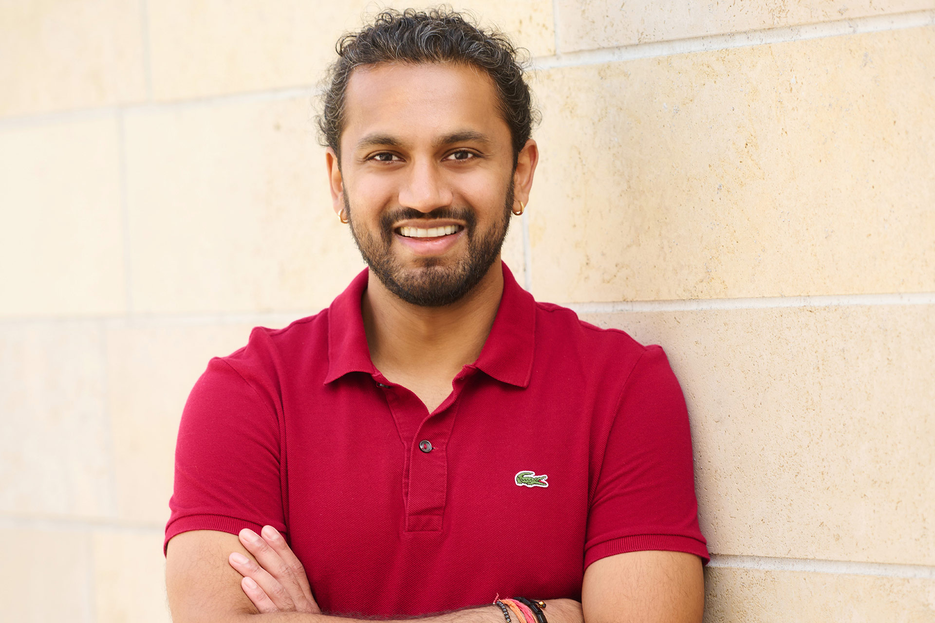 How Long Should a First Date Last Man smiling in a casual portrait for first date and dating profile advice.
