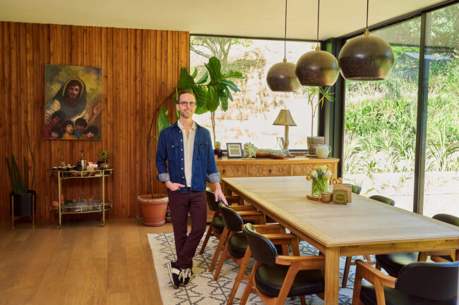 Realtor lifestyle photo in Los Angeles, professional man photographed in a warm home dining room, polished image for realtor website, Zillow profile, social media, marketing, and personal branding