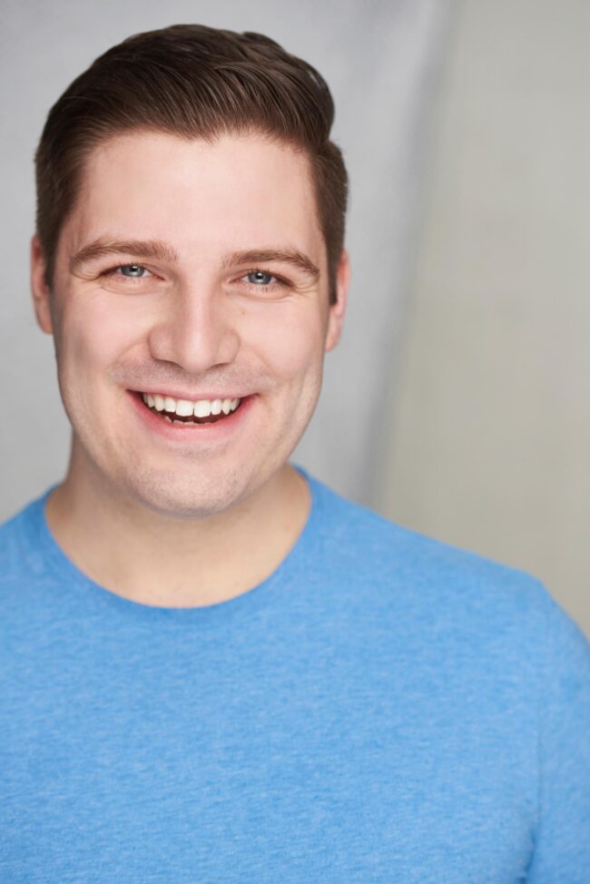 Male actor headshot in Los Angeles, comedic commercial casting photo with a bright smile for agents, managers, auditions, online casting profiles, and acting submissions