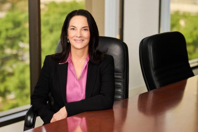 Professional headshot in Los Angeles, woman photographed in a boardroom setting with a polished approachable look, useful for website bio, LinkedIn profile, resume, company profile, and professional use
