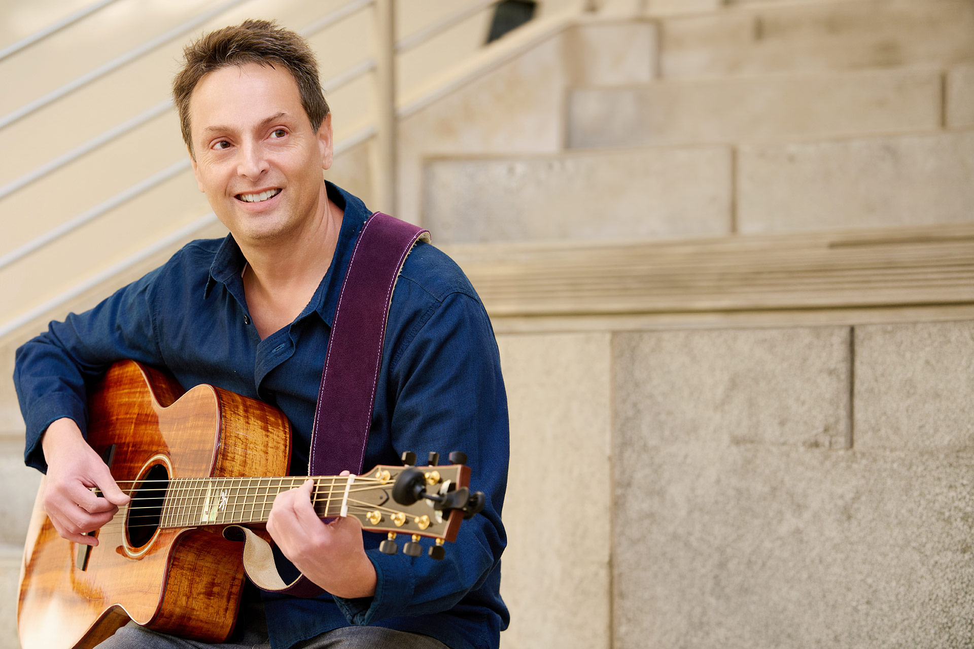 How Long Should a First Date Last Man playing guitar in a relaxed lifestyle photo for dating advice.